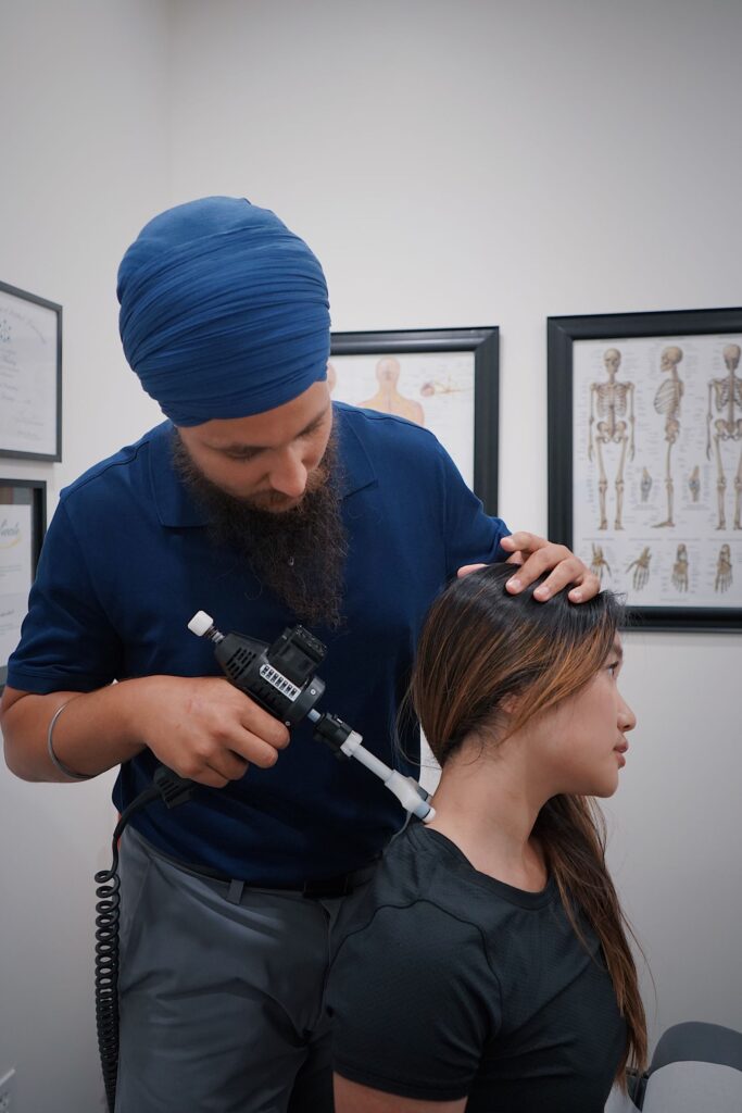 Chiropractor treating a patient neck